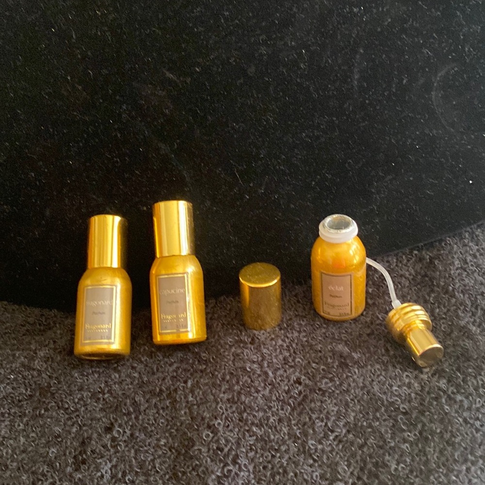 Three refillable perfume bottles